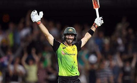 Australia's batsman Glenn Maxwell celebrates scoring his century against England during their Twenty20 cricket match at Bellerive Oval in Hobart on February 7, 2018. | AFP