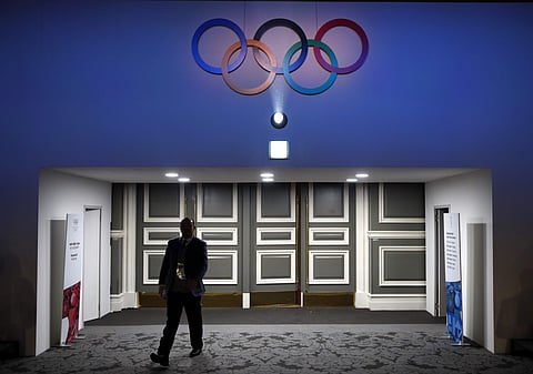 A member of the International Olympic Committee walks into the 132nd IOC Session prior to the 2018 Winter Olympics in Pyeongchang, South Korea. | AP