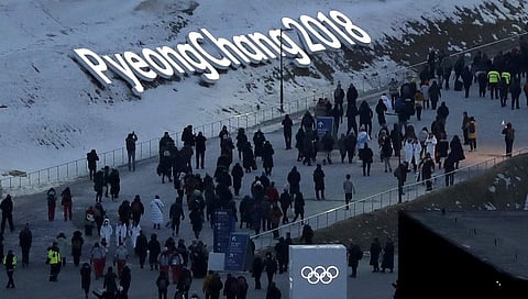 People arrive at the Olympic Stadium ahead of the opening ceremony | AP