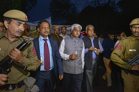 Delhi Chief Secretary Anshu Prakash leads a candle light march from Delhi Secretariat to Rajghat over the recent assault on him by AAP MLAs in New Delhi on Wednesday. | PTI
