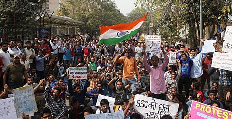 Students staging protest outside Staff Selection Commission against question paper leak in New Delhi on Thursday. (Express Photo | Shekhar Yadav)