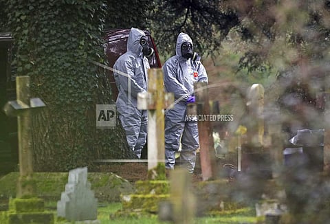 Forensic officers work at the cemetery in Salisbury, England, Saturday March 10, 2018, as investigations continue at the cemetery where former Russian double agent Sergei Skripal's wife Liudmila and son Alexander are laid to rest. | AP