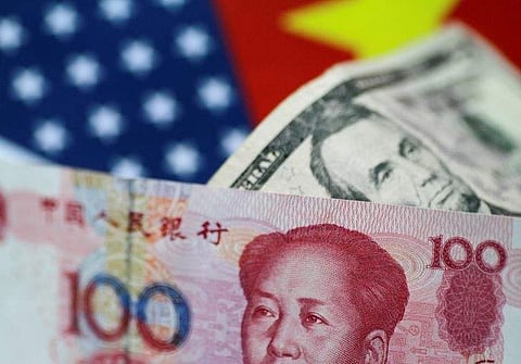 U.S. Dollar and China Yuan notes are seen in this picture illustration. (File | Reuters)