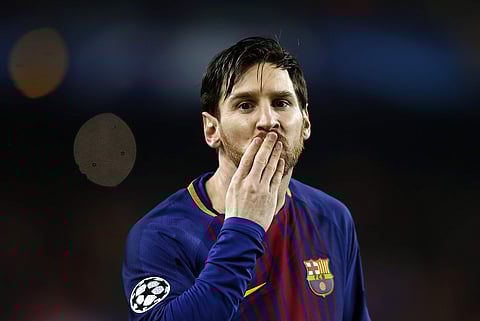 Barcelona's Lionel Messi blows a kiss after scoring the opening goal during the Champions League round of sixteen second leg soccer match against Chelsea. | AP