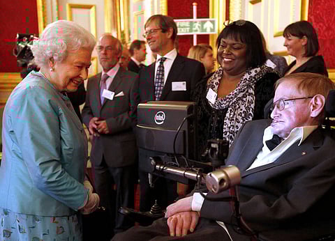 In this May 29, 2014 file photo, Britain's Queen Elizabeth II meets Professor Stephen Hawking, during a reception for Leonard Cheshire Disability in the State Rooms, St James's Palace, London. (File| AP)