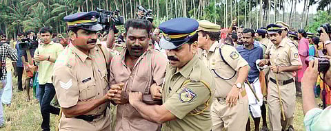 Police forcefully removing the Vayalkkili activists at Keezhattur in Kannur on Wednesday | Express