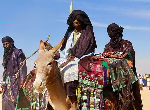 Tuareg men ride on camels during the Niger Tuareg festival in Iferouane, Niger. The festival is one of the many attempts by the people to attract tourists amidst concerns of Islamic extremism concerns failing tourism. (Photo: AP)