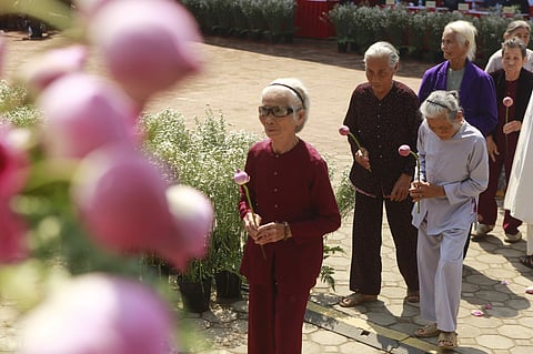 My Lai massacre survivors lay flowers during a ceremony to remember victims of the massacre in My Lai, Vietnam Friday, March 16, 2018. (Photo | AP)