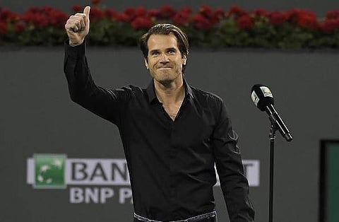 Tommy Haas, of Germany, gestures to fans after announcing his retirement, following Roger Federer's quarterfinal match against Chung Hyeon at the BNP Paribas Open tennis tournament, Thursday, March 15, 2018, in Indian Wells. (AP)