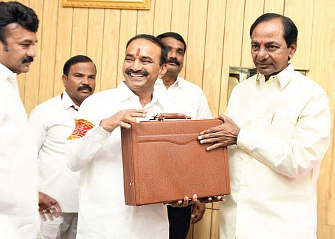 Finance Minister Etela Rajender and Chief Minister K Chandrasekhar Rao present the State Budget in the Assembly on Thursday | Express