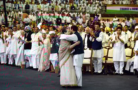 Congress President Rahul Gandhi hugs his mother Sonia Gandhi after her speech at the 84th Plenary Session of Indian National Congress at the Indira Gandhi Stadium in New Delhi on Saturday. | PTI