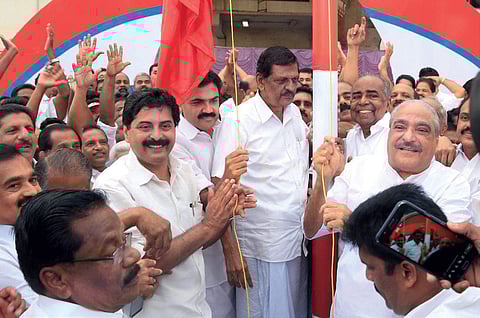 File: KC(M) chairman K M Mani hoisting the party flag in the presence of other leaders of the party | Vishnu Prathap