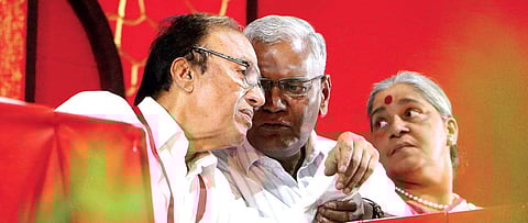 CPI general secretary S Sudhakar Reddy having a word with party national secretary D Raja during the delegates’ meet of the CPI state conference in Malappuram on Thursday. Party leader Annie Raja is also seen  | T P Sooraj