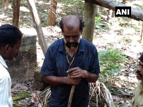 The former sexton Johny Vattekkadan is taken into custody from a farm near the first station of the Kurisumala pilgrimage, a renowned pilgrim center. Photo| ANI/ Twitter