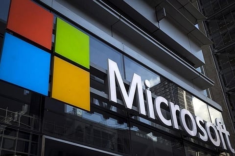 A Microsoft logo is seen on an office building in New York City. (Photo | Reuters)