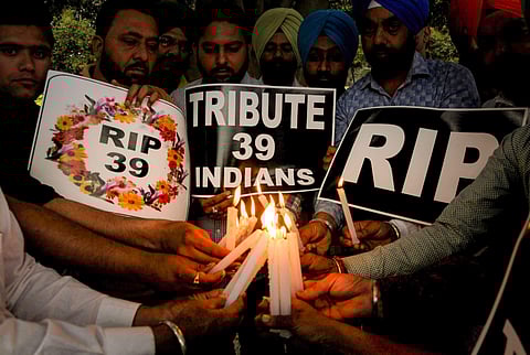 Members of National Human Rights and Crime Control Organization light candles to pay tribute to the 39 Indian workers who were feared killed in Iraq in Amritsar on Tuesday. | PTI