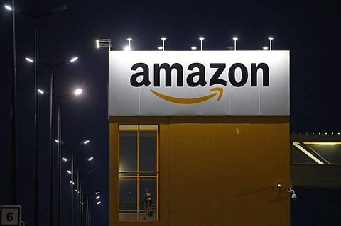 The logo of Amazon is seen at the company logistics center in Lauwin-Planque, northern France. (Photo | Reuters)