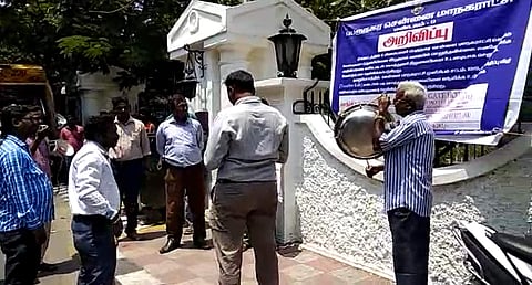 A video released by officials shows the group shaming the establishment through a loud speaker by the busy junction outside the hotel. (Screengrab)