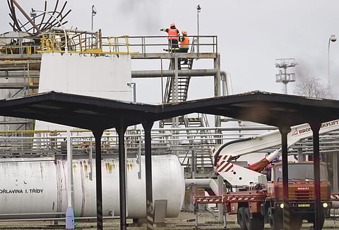 People work at the site of an explosion in a chemical plant in Kralupy nad Vltavou, Czech Republic, Thursday, March 22, 2018. Vladimira Kerekova, spokeswoman for the regional firefighters, says an explosion in a chemical factory, north of Prague, the Czec