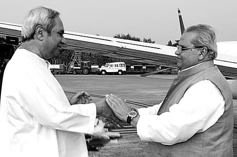 Chief Minister Naveen Patnaik welcomes Bihar Governor Satya Pal Malik at the airport in Bhubaneswar on Wednesday | Express