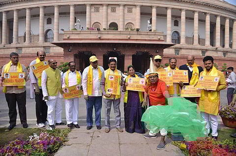 A file image of TDP MP Sivaprasad (in red) dressed as a fisherman during their protest demanding special status for the state of AP during the budget session of Parliament last week (File | EPS)