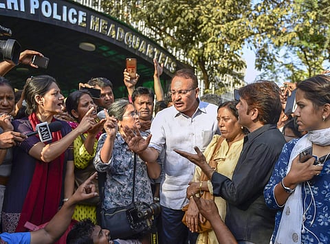Journalists from various organisations protest outside the Police Headquarter against 2 women journalist molestation case in New Delhi on Saturday. (PTI)