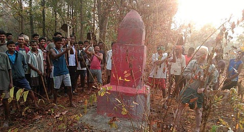 Villagers gather at one of the allegedly destroyed monuments built in memory of Naxal commanders