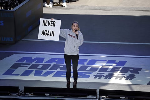 Miley Cyrus performs 'The Climb' during the 'March for Our Lives' rally in support of gun control in Washington | AP Photo