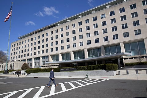 People walk near the U.S. State Department in Washington, Monday, March 26, 2018.  | AP