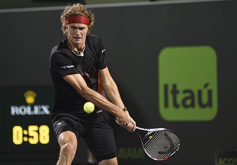 Alexander Zverev returns to Nick Kyrgios during the Miami Open tennis tournament. | AP