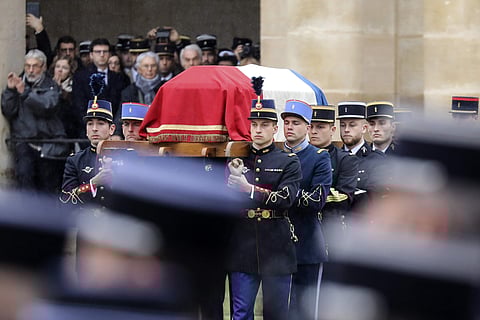 French Republican Guards and cadets from the joint-army military school carry the coffin of late Lt. Col. Arnaud Beltrame during a national ceremony for Beltrame at the Hotel des Invalides in Paris. | AP