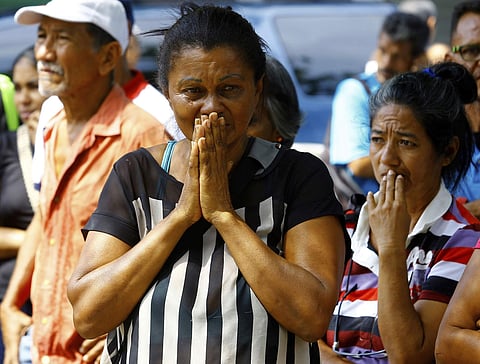 Relatives wait to hear news about the fate of detained prisoners at a police station where a riot broke out, in Valencia, Venezuela, Wednesday, March 28, 2018. (AP Photo)