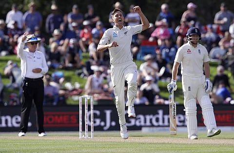 New Zealand's Trent Boult, centre, celebrates after dismissing England's Ben Stokes during play on day one of the second cricket test against New Zealand at Hagley Oval. (AP)