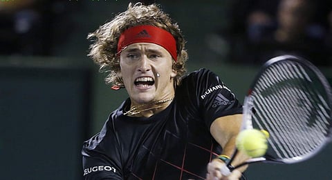 Alexander Zverev returns a shot from Borna Coric during a quarterfinal at the Miami Open. | AP