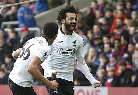 Liverpool's Mohamed Salah celebrates after scoring his side's second goal of the game during the English Premier League soccer match between Crystal Palace and Liverpool at Selhurst Park stadium in London, Saturday, March 31, 2018. | AP