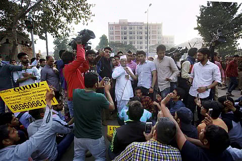 Anti-corruption crusader Anna Hazare arrives to meet Staff Selection Commission (SSC) aspirants in New Delhi on Sunday. | PTI