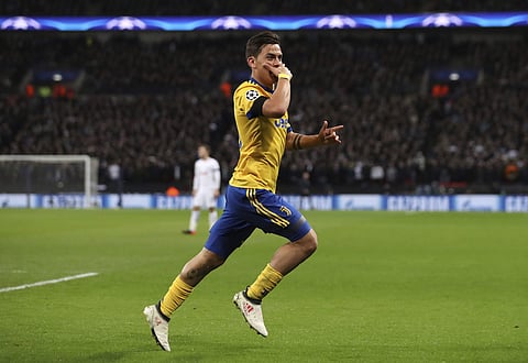 Juventus' Paulo Dybala celebrates scoring his side's second goal against Tottenham Hotspur during the Champions League round of 16 | Photo: AP