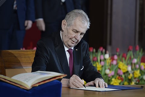 Czech President Milos Zeman signs the presidential oath during the inauguration ceremony. (Photo | AP)