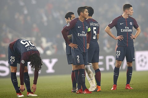 PSG players react to losing the Champions League round of sixteen second leg match against Real Madrid. | AP