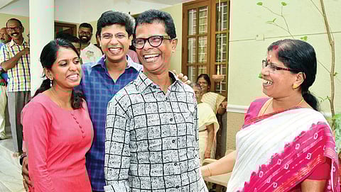Actor Indrans, along with wife Shantha Kumari, son Mahendran and daughter-in-law Swathi, rejoice at their house in Thiruvananthapuram after he was adjudged the best actor at the  48th Kerala State Film Awards on Thursday (EPS | B P Deepu)