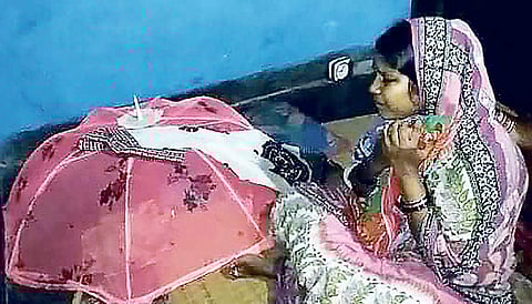 Sarojini near the bed of her baby in the house and (inset) the baby after birth in Sishu Bhavan I EXPRESS