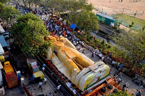 The 62-foot-tall, 750-tonne Hanuman statue taken through Kacharakanahalli Main Road in HBR Layout on Monday. (EPS | Pushkar V)