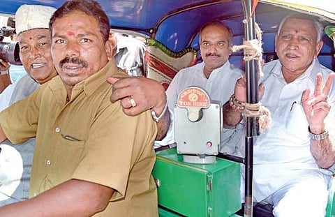 B S Yeddyurappa, MP P C Mohan and former MLA Katta Subramanya Naidu take an auto ride from Dollar’s Colony on Monday | Nagaraja Gadekal