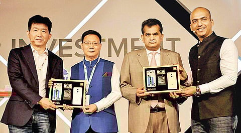 (L-R)Xiaomi VP Zhang Feng, minister counsellor in the Chinese Embassy Li Bijian Niti Aayog CEO Amitabh Kant and Xiaomi India MD Manu Kumar Jain, during the Supplier Investment Summit in New Delhi on Monday | PTI