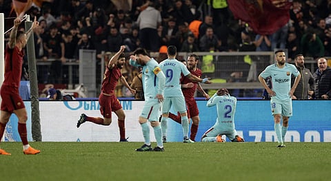 Players react after Roma's Kostas Manolas scored his side's 3rd goal, during the Champions League quarterfinal second leg soccer match between Roma and FC Barcelona at Rome's Olympic Stadium, Tuesday, April 10, 2018.  | AP