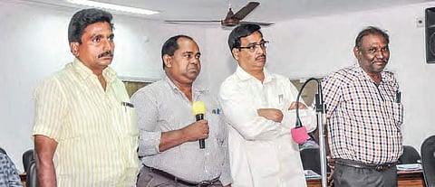 Assistant medical officers health of public health department answering questions posed by corporators during council meet in Vijayawada on Wednesday | Express