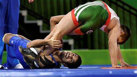 Rahul Aware wrestles with Pakistan's Muhammad Bilal in the men's freestyle 57kg wrestling semifinal match | PTI