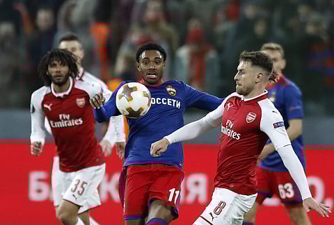 CSKA's Vitinho, center, challenges for the ball with Arsenal's Aaron Ramsey, right, during the Europa League quarterfinal, second leg soccer match between CSKA Moscow and Arsenal at the CSKA Arena, in Moscow, Russia, Thursday, April 12, 2018. | AP