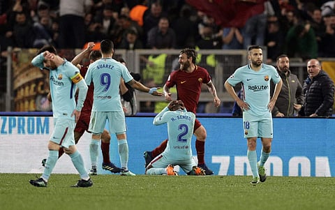 Roma's Daniele De Rossi, 2nd right, celebrates after Kostas Manolas scored his side's 3rd goal, during the Champions League quarterfinal second leg soccer match between Roma and FC Barcelona at Rome's Olympic Stadium, Tuesday, April 10, 2018. | AP