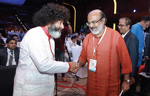 Finance Minister T M Thomas Issac greeting Mahatria Ra, the founder of Infinitheism, at the inaugural session of the All-Kerala Management Associations’ Summit and Annual National Management Convention of Kerala Management Association at International Con